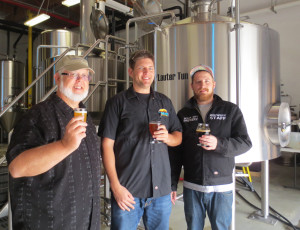 A toast to Glenn (center) and Derek (right) on the success of Beach City Brewery.