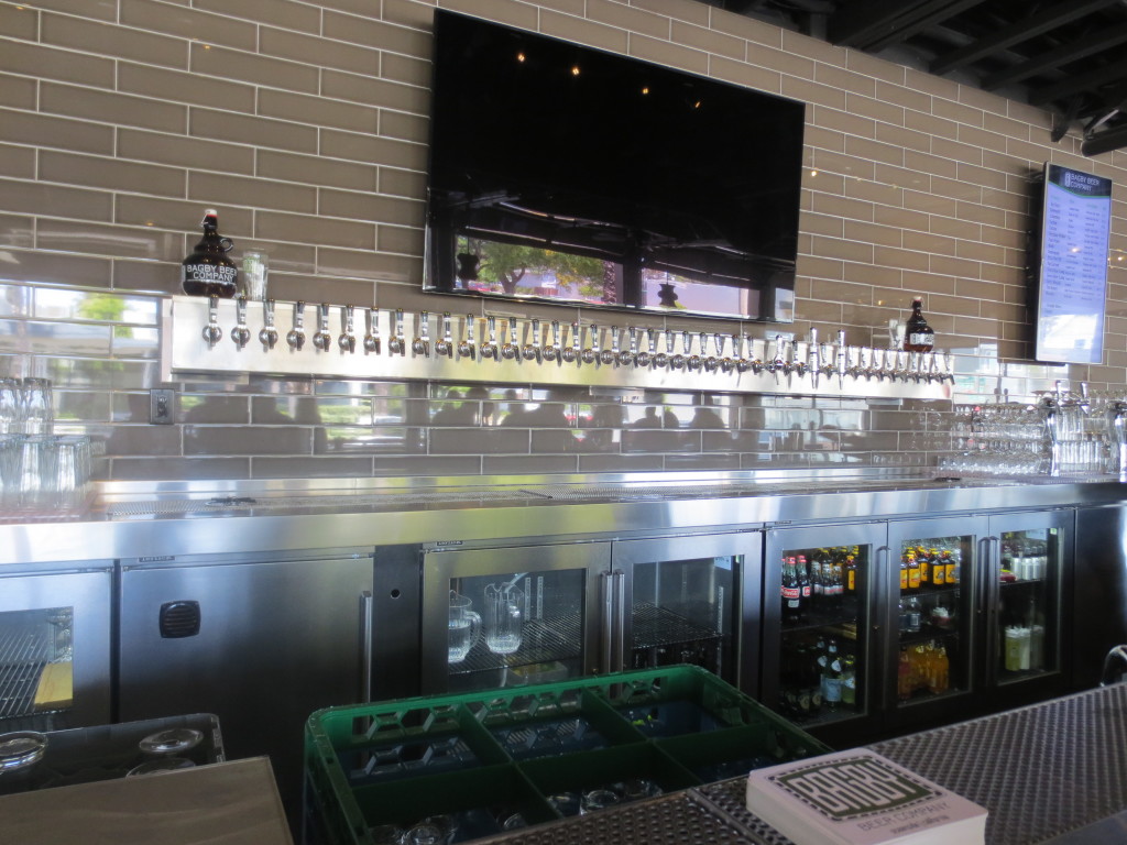 41 tap handles line the wall in the main bar area at Bagby Beer Company.
