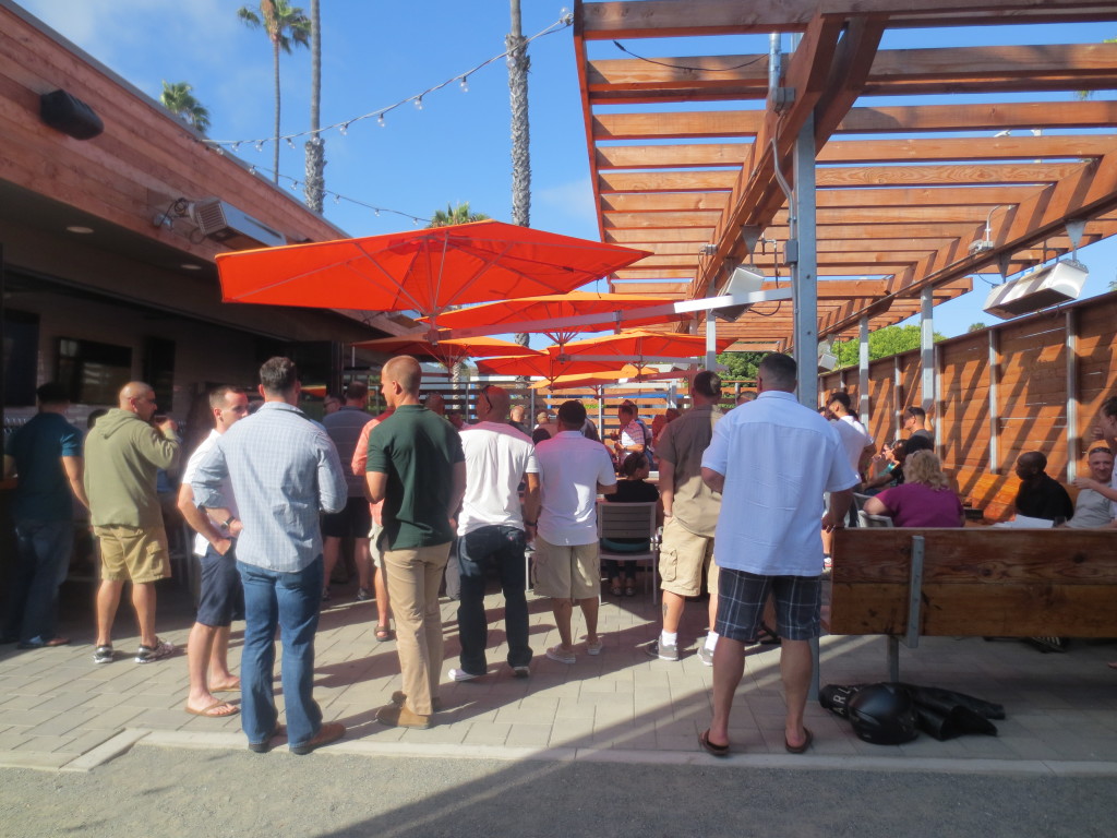A group of patrons enjoy the weather in a corner of Bagby Beer Company's outdoor beer garden. 