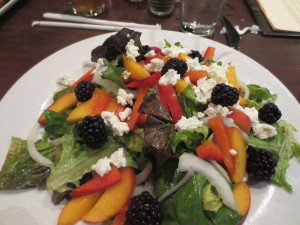 This salad featured local organic greens, berries, and cheese.